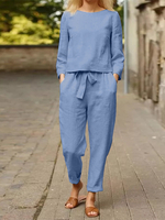 Ensemble deux pièces à manches longues avec poche à taille élastique et cravate unie sur le devant