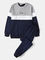 Haut décontracté à col rond et épissure bleu collégial pour hommes avec des costumes de pantalons solides
