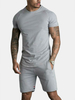 Hommes Sport manches courtes couture rayures shorts de poche couleur unie deux pièces survêtement