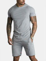 Hommes Sport manches courtes couture rayures shorts de poche couleur unie deux pièces survêtement