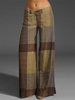 Pantalon à carreaux avec poche zippée et bouton pour femme