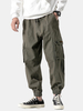 Pantalon décontracté de couleur pure pour hommes avec poches élastiques à la taille