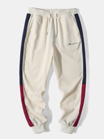 Pantalon décontracté en patchwork contrasté brodé de caractères en velours côtelé pour hommes