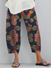Pantalon décontracté irrégulier à poches latérales imprimé floral ethnique pour femmes