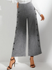 Pantalon décontracté lâche de garniture de bouton latéral de taille haute de couleur unie pour des femmes