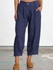 Pantalon décontracté pour femme avec poche boutonnée de couleur unie