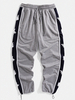 Pantalon de jogging avec cordon de serrage et patchwork sur le côté pour homme