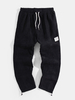 Pantalon de jogging épais en velours côtelé de couleur unie pour homme avec cordons élastiques