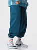Pantalon de manchette collant occasionnel de couleur unie pour hommes avec la taille de boucle de poussée