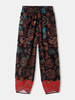 Pantalon de taille élastique à revers irrégulier à motif ethnique pour femmes avec poche