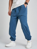 Pantalon en velours côtelé de couleur unie pour hommes avec cordon de serrage à la taille