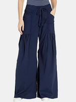 Pantalon large à jambe large et taille élastique de couleur unie pour femmes avec poche