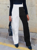 Pantalon large à taille haute en patchwork de couleurs contrastées noir et blanc pour hommes