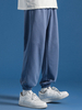 Pantalon lâche de sport de taille élastique de poche de cordon de couleur unie pour des femmes