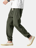 Pantalon sarouel à cordon élastique décontracté de couleur unie pour homme