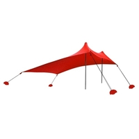 Abri de soleil de tente de plage avec des sacs de sable pour la pêche de camping