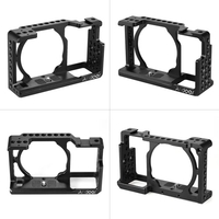 Andoer Protective Video Camera Cage Stabilizer Protector avec câble HD Clamp Clip pour Sony A6000 A6300 NEX7 ILDC pour monter le microphone Moniteur Trépied Accessoires d