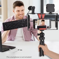 Andoer Smartphone Video Rig Vlog Kit comprenant une cage pour smartphone avec pince pour téléphone 3 supports de chaussures froides + Mini lampe vidéo LED rechargeable 5600K + Microphone + Trépied de bureau + Obturateur à distance pour l