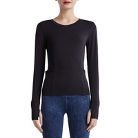 Chemise de sport pour femmes couleur unie col rond à manches longues moulante poche trou de doigt Yoga course Gym haut sweat-shirt