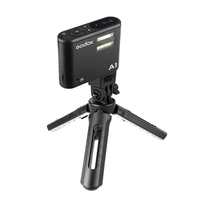 Godox A1 Phone Flash OLED Display Built-in 2.4G Système de système X sans fil APP Télécommande Master Slave Fonctions avec MT01 Mini trépied Andoer chiffon de nettoyage et support de téléphone réglable pour iPhone 7/7 plus / 6s / 6s plus