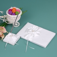 Livre de signature de Guset blanc de mariage de ruban de satin et support de stylo avec la décoration de Bowknot de fausse pierre de fausse pierre