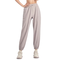 Pantalon de sport pour femme couleur unie élastique taille haute avec cordon de serrage poche lâche respirant course Yoga pantalon de gymnastique