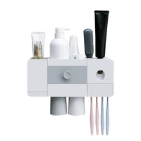 Support de brosse à dents avec distributeur automatique de dentifrice