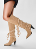 Bottes hautes en daim à bout pointu et talon conique à lacets