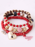 Bracelets empilables perlés sertis de breloque gland
