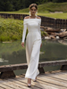 Combinaison de mariée en crêpe stretch plissée longueur cheville col bateau manches longues taille naturelle blanche