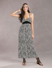 Magnétique robe maxi bohémienne en rayonne noir effet impression