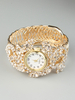 Montre-bracelet brillante en alliage métallique avec strass et bracelet doré pour femmes