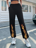 Pantalon noir en polyester à taille surélevée avec motif imprimé de flammes