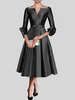 Petite robe noire jolie col en V manches 3/4 nœuds tissu satiné ligne trapèze