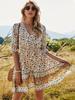 Robe bohème à col en V et demi manches à imprimé floral Robe de plage mi-longue plissée extensible