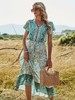 Robe bohème col en V manches courtes imprimé floral robe de plage mi-longue plissée extensible