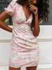 Robe dété fleurie à col en V et manches bouffantes