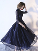 Robe de cocktail en tulle noir col rond paillete asymétrique