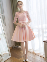 Robe de cocktail rose pâle en dentelle col rond demi-manche en dentelle décoré de noeud longueur au genou