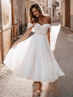 Robe de mariée courte en tulle paillete hors de l
