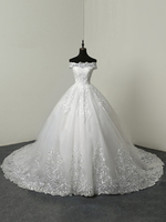Robe de mariée pincesse ivoire col bateau laçage sur dos à traîne ronde robe de mariage