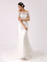 Robe de mariée sirène en dentelle ivoire hors de l