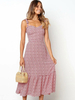 Robe longue à fleurs sans manches avec volants formant la robe dété