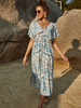 Robe longue à manches courtes et imprimé floral blanc à col en V plissé asymétrique en polyester Robe longue