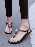 Sandales plates pour femmes avec des fleurs