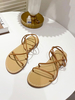 Sandales plates pour femmes bout rond talon plat en cuir PU sandales à lacets