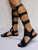 Sandales spartiates noires Sandales plates hautes au genou