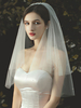 Voile de mariée à deux niveaux de perles en tulle à bord coupé