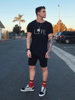 Vêtements de sport pour hommes 2 pièces à manches courtes et col bijou noir